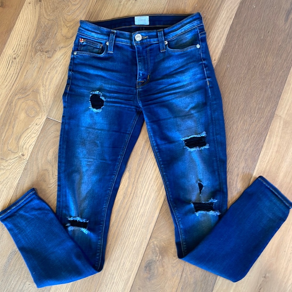 Hudson mid rise ripped jeans with cute black threading on the rips.